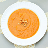 Smooth and creamy roasted butternut squash sweet potato soup is the perfect way to start your Thanksgiving meal! #vegan #glutenfree #thanksgiving #butternutsquash