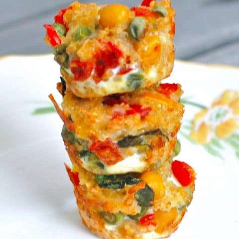 veggie quinoa bites stacked on a plate