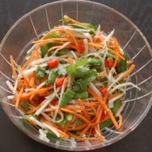 Daikon, carrots, red peppers, and snap peas come together with a lime ginger dressing in this light and refreshing Thai Citrus Salad | Nutritioulicious @JLevinsonRD