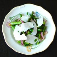 Earthy asparagus is tossed with crisp red onions, refreshing mint, zesty lemon, and salty ricotta salata cheese in this Asparagus Mint Salad that will get you in the spirit of spring and wake up your taste buds. Get the recipe at JessicaLevinson.com. #vegetarian #glutenfree #asparagus #springrecipes #salad