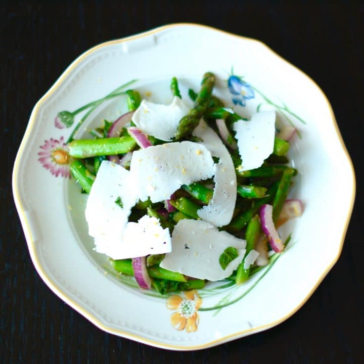 Earthy asparagus is tossed with crisp red onions, refreshing mint, zesty lemon, and salty ricotta salata cheese in this Asparagus Mint Salad that will get you in the spirit of spring and wake up your taste buds. Get the recipe at JessicaLevinson.com. #vegetarian #glutenfree #asparagus #springrecipes #salad