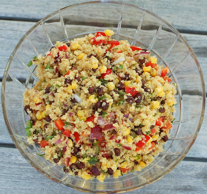 corn and black bean quinoa salad in glass bowl