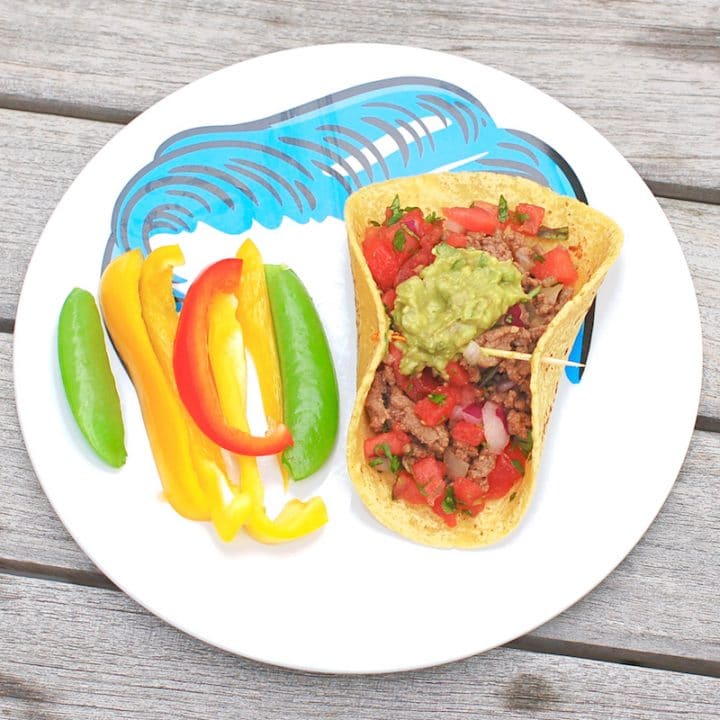 The whole family can participate in taco night with these smoky chipotle beef tacos topped with cooling guacamole and watermelon salsa! Get the gluten-free, dairy-free, and family-friendly recipe @jlevinsonrd.