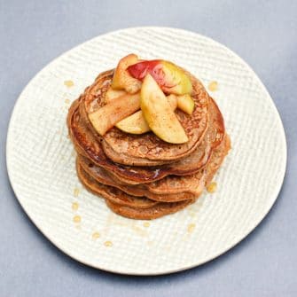 Take your favorite snack duo to breakfast or brunch with these apple peanut butter pancakes topped with sautéed cinnamon apples. #eggfree #vegetarian #pancakes #peanutbutter #applesandpeanutbutter #breakfast #healthyrecipes