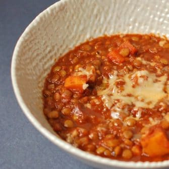 Hearty Vegetable Lentil Chili | Warm up with a bowl of hearty lentil chili that's packed with vegetables and brimming with flavor and nutrition. Enjoy topped with shredded cheese or mashed avocado. Get the vegan and gluten-free recipe @jlevinsonrd.