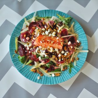 This Salmon Waldorf Salad combines mixed greens, ruby red beets, crisp fennel and green apple, crunchy pistachios, creamy goat cheese, and heart-healthy salmon with a citrus yogurt vinaigrette. A nutritious and delicious twist on the classic Waldorf salad. #glutenfree #salmon #salad #waldorfsalad #beets #fennel #goatcheese