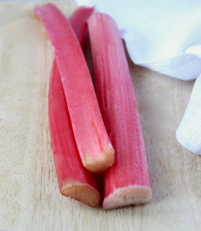 Fresh Rhubarb stalks on cutting board