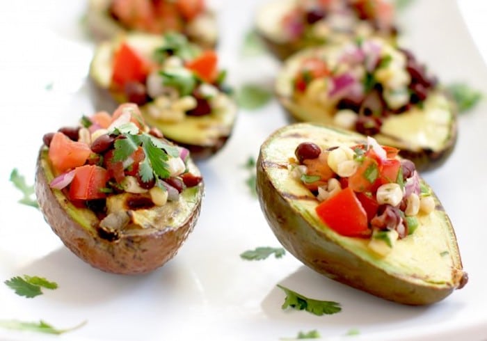 Grilled Avocados with Black Bean Salsa on White Platter