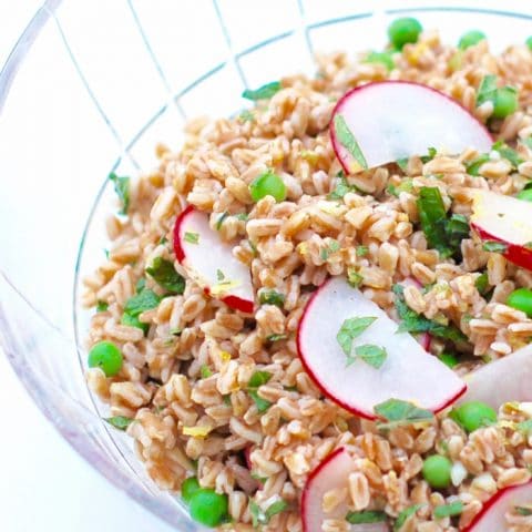 spring farro salad in cut glass serving bowl