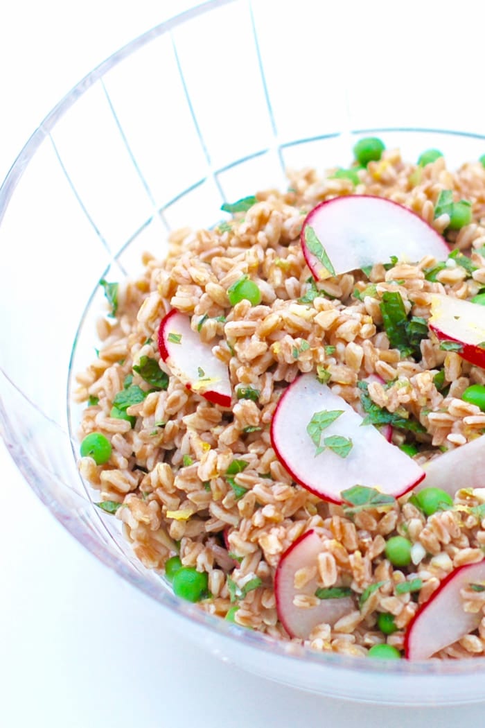 spring farro salad in cut glass serving bowl