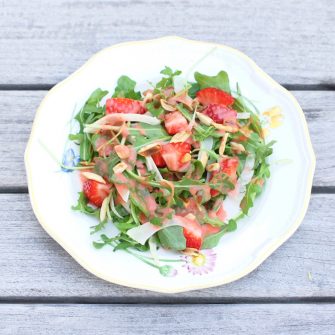 Strawberry Arugula Salad with Fennel, Toasted Almonds, and Strawberry Champagne Vinaigrette is a fresh and sweet salad for the spring and summer. Via JessicaLevinson.com | #salad #strawberries #glutenfree #veganfriendly #vegetarian #dairyfree #fennel