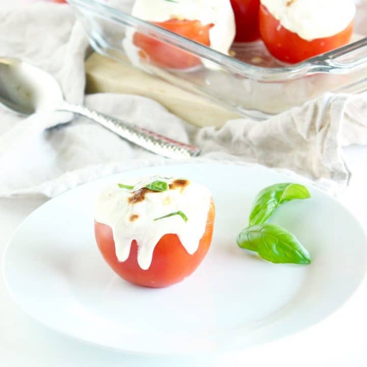 Learn about the varieties, health benefits, & culinary uses of fresh summer tomatoes. Then enjoy delicious & healthy Caprese Couscous Stuffed Tomatoes! Get the quick and easy, vegetarian recipe @jlevinsonrd.