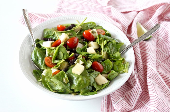 spinach salad with jicama in bowl