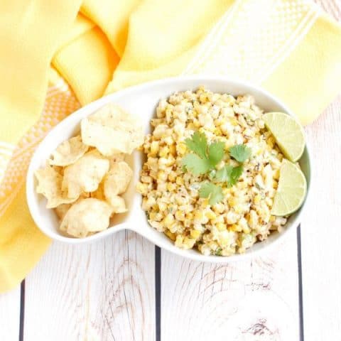 This lighter version of the classic Esquites Mexican street corn salad is made with low-fat plain yogurt instead of mayonnaise to save on calories without sacrificing flavor. Serve as an appetizer with corn chips or as a side dish for your next Taco Tuesday, Cinco de Mayo celebration, or weekend barbecue. Get the recipe at JessicaLevinson.com | #vegetarian #glutenfree #corn #mexicancorn #recipemakeover #healthyrecipes #summerrecipes