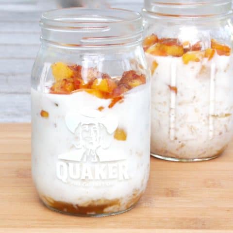 prepared mason jars of peaches and cream overnight oats