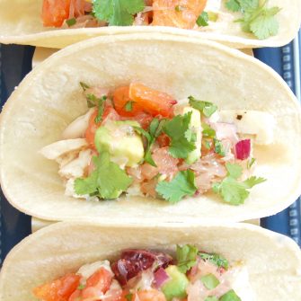 Fish Tacos with Citrus Salsa are a quick and easy, flavor-packed dinner the whole family will enjoy. Get the gluten-free, dairy-free recipe @jlevinsonrd.