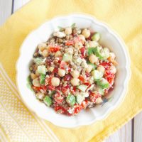 Lentil Chickpea Vegetable Salad with Feta | Protein- and fiber-rich lentils and chickpeas, crunchy bell peppers and Persian cucumbers, sweet pomegranate seeds, and salty feta cheese are tossed together in a lemony maple-mustard vinaigrette for a kid-friendly and adult approved lunchbox salad. Get this gluten-free, nut-free, vegetarian, and vegan-friendly recipe @jlevinsonrd.