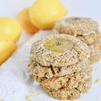 Welcome spring with this sweet and tangy Lemon Poppy Seed Thumbprint Cookie recipe! Soft and chewy lemon poppy seed cookies are dolloped with zesty lemon curd and a simple glaze for the perfect springtime treat. Get the vegetarian and nut-free recipe at JessicaLevinson.com