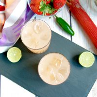 Spicy Strawberry Rhubarb Margaritas are the perfect complement for Taco Tuesdays or any Mexican-themed party during the spring and summer. Get the cocktail recipe @jlevinsonrd.
