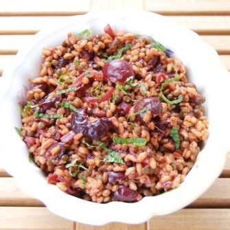 Roasted Cherry Farro Salad is a sweet and savory dish hearty enough for a light lunch and perfect as a side dish next to your favorite entrée. Get the vegan and nut-free recipe @jlevinsonrd.