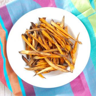 Crispy baked sweet potato fries are easy to make, kid-friendly, and delicious. The perfect side dish for any weeknight family dinner! Get the recipe at JessicaLevinson.com | #GlutenFree #Vegan #recipe #sweetpotato #frenchfries #vegetarian #healthyrecipes #recipemakeover