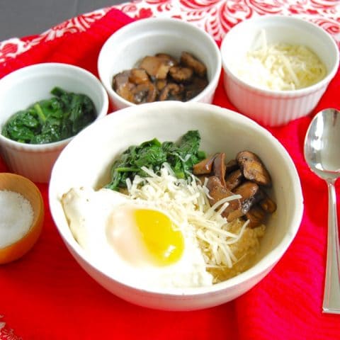 Get a serving of vegetables and protein at breakfast with this umami-rich savory oatmeal breakfast bowl with spinach, mushrooms, and fried egg. Get the gluten-free, vegetarian, and vegan-friendly recipe @jlevinsonrd.