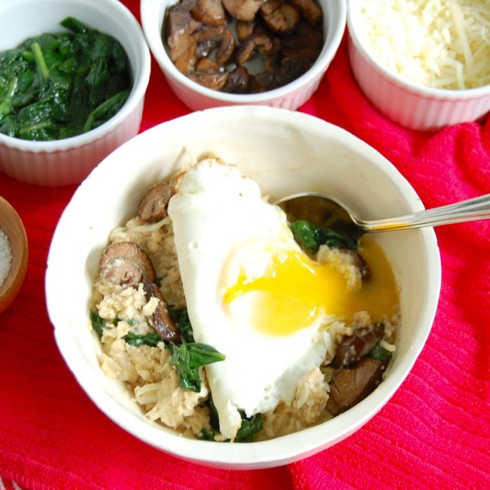 savory oatmeal bowl with runny fried egg