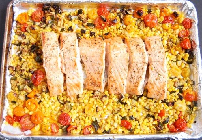 Mediterranean Sheet Pan Salmon with Zucchini, Corn, and Tomatoes is quick and easy to make and clean up. A perfect weeknight dinner for busy families. Get the recipe at JessicaLevinson.com | #glutenfree #dairyfree #eggfree #nutfree #salmon #recipe #sheetpanmeal #sheetpandinner #zucchini #corn #tomatoes #summerrecipes #summerveggies