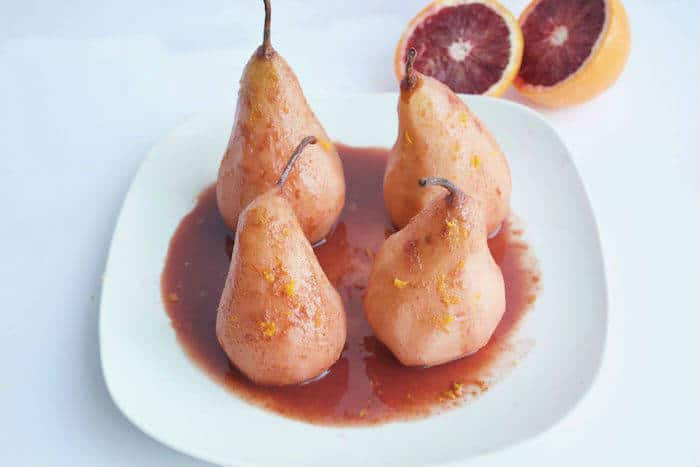 Blood Orange Poached Pears on White Plate