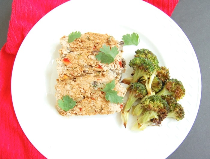 Asian-style turkey meatloaf sliced on plate with broccoli