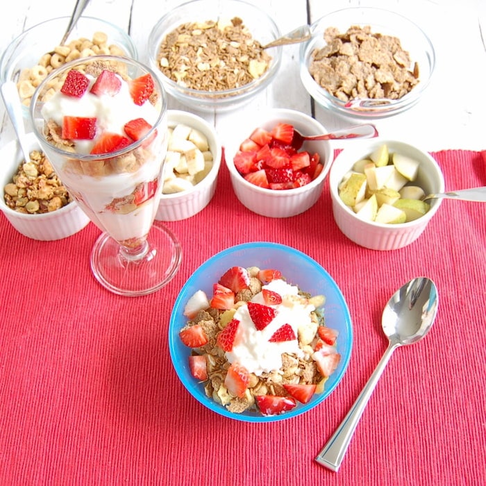 Yogurt and cottage cheese parfait with whole grain cereal and fruit