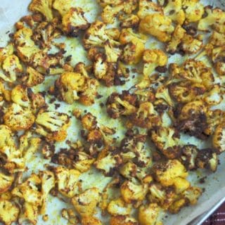 Golden Roasted Cauliflower is a simple side dish that is healthy, delicious, and brightens up any table. Vegan and gluten-free.
