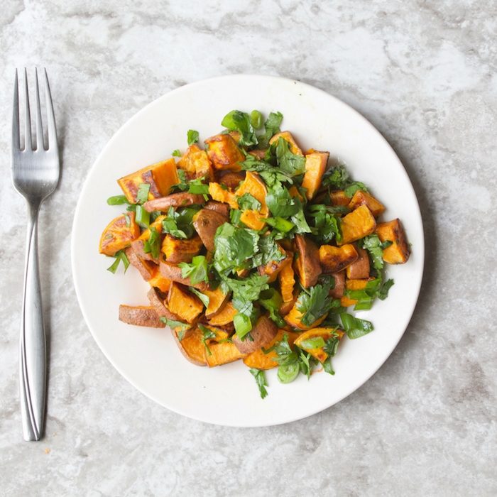 Lighten up classic potato salad with roasted sweet potato salad tossed with cilantro, scallions, and a honey lime vinaigrette via JessicaLevinson.com