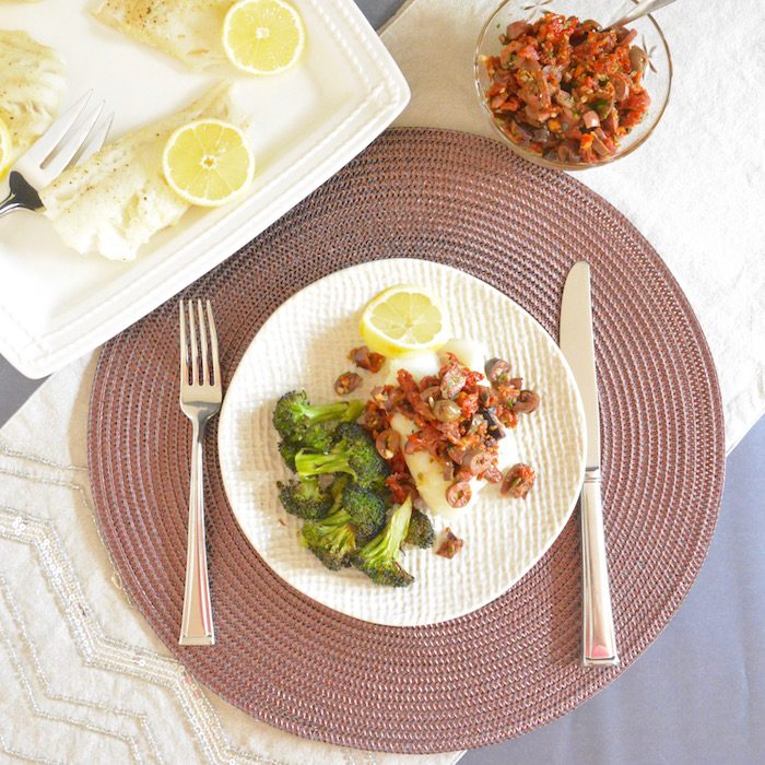 Oven Baked Cod with Sun Dried Tomato Olive Tapenade on plate