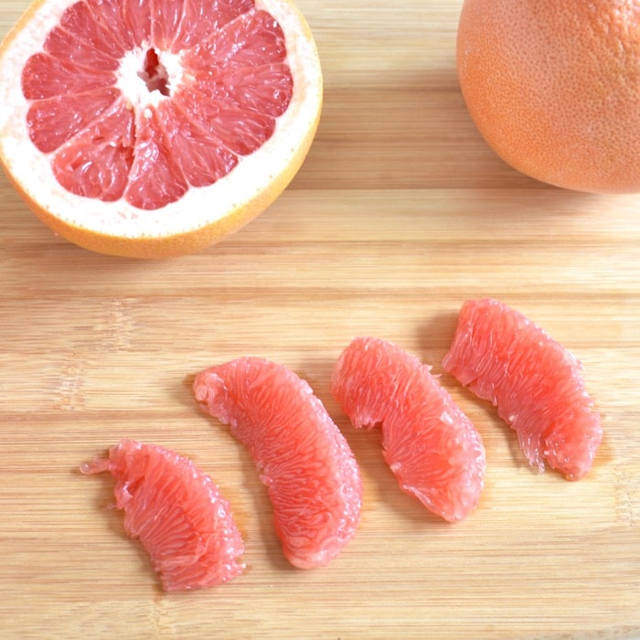 Enjoy grapefruit cut in segments